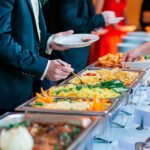 a group of people serving food